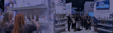 People interacting with a display at a trade show or conference.